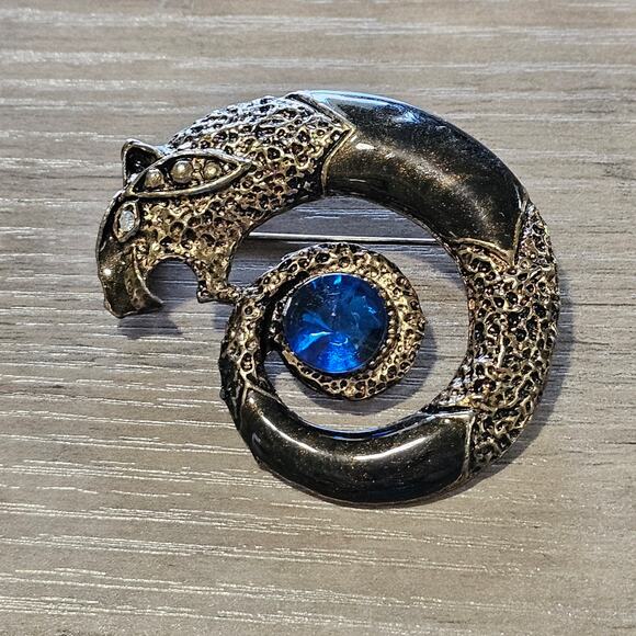 Vintage Panther Brooch Black and Silver Serpent Tail with Blue Crystal Center